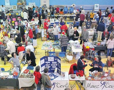 Matt Hinshaw/The Daily Courier<br>
Shoppers make their way around the 2009 Last-Minute Non-Profit Stocking Stuffer Bazaar. Non-profit groups sell wares to generate money for their groups.