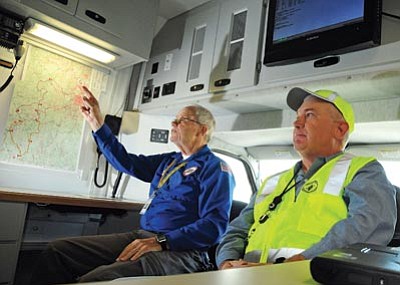 Brett Soldwedel/The Daily Courier<br>
Lloyd Halgunseth, left, and Jim Zimmerman sit in the mobile command center of Amateur Radio Emergency Service, which is celebrating its 75th anniversary. ARES helps with rescue and other emergency efforts when communications are out.