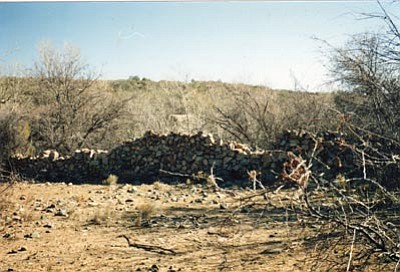 Judy Stoycheff/Courtesy photo<br>This photo of the stone corral at Ash Creek, taken in 1993 by the author, shows how well the century-old rock wall has endured. It was used for stock during the 1870s and 1880s by the John Stemmer Station and continuing with A, J. Hudson’s Ash Creek Station until the end of the 1890s.