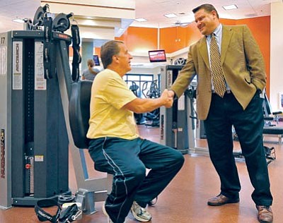 Matt Hinshaw/The Daily Courier<br>
New YMCA Executive Director Damon Olsen introduces himself to Paul Medlyn Thursday afternoon in the YMCA gym in Prescott.