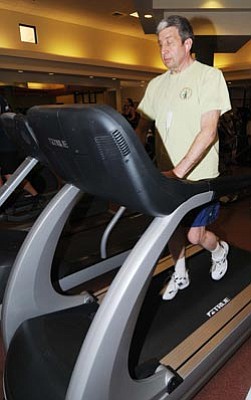 Les Stukenberg/The Daily Courier<br>Howard Chak has lost 25 pounds since signing up for the Prescott YMCA Holiday Challenge. He continues to work out at the YMCA, hoping to lose another 8-10 pounds.