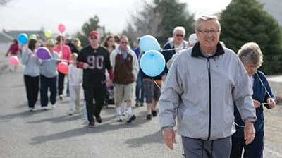 Les Stukenberg/The Daily Courier<br>
Mayor Harvey Skoog leads the second annual Mayor’s March to raise money for Meals on Wheels, hosted by the CASA Senior & Community Center in Prescott Valley on Saturday morning.