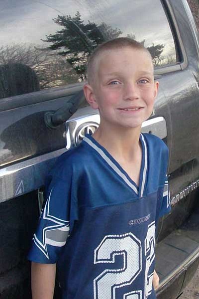 T.J., 8, is a cute little boy with blue eyes, buzz-cut blonde hair and a ready smile.