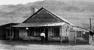 Sharlot Hall Museum/Courtesy photo<br>
Charles P. Stanton poses in front of his store in the mining town named for him circa 1880. He was known for his cruelty, vice and corruption in the little community, and folklore abounds with stories of his reputed activities.