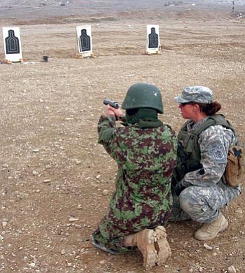 U.S. Army/Courtesy photo<br /><br /><!-- 1upcrlf2 -->U.S. Army Sgt. Sherri Jo Gallagher, right, instructs women officers in the Afghan National Army in rifle and pistol marksmanship on training ranges in Afghanistan during Operation Tribute to Freedom.