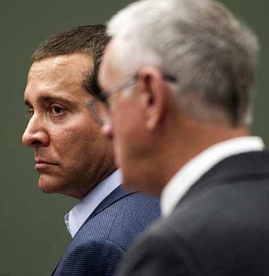 Tom Tingle/The Associated Press<br>James Arthur Ray, left, and his attorney, Thomas Kelly, right, stand in the courtroom of Judge Warren R. Darrow, in the Yavapai County Courthouse in Camp Verde Wednesday. The sweat lodge trial that has been going on for months was handed to the jury Tuesday.
