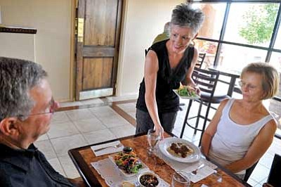 Matt Hinshaw/The Daily Courier<br>Donya Marie Schweizer, co-owner of Donya Marie’s Beyond Chocolate, serves Diana and Gary Radil their lunch Tuesday morning in Prescott Valley. The restaurant opened its doors this past May.