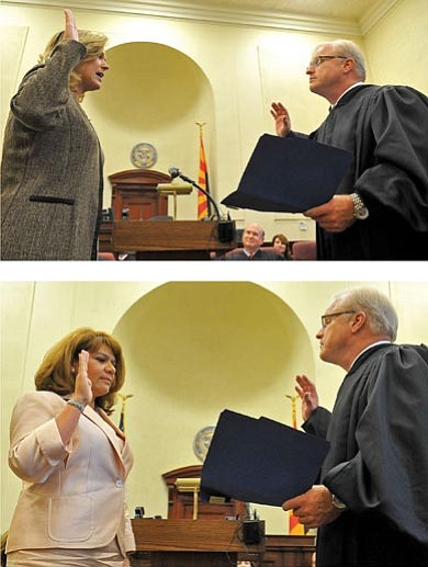Matt Hinshaw/The Daily Courier<br>
The Honorable Robert M. Brutinel administers the oath of office to Jennifer B. Campbell, above, and Patricia A. Trebesch Friday afternoon.


