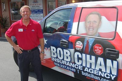 Jason Soifer/The Daily Courier<br>Bob Cihan opened his Farmers Insurance office in May in downtown Prescott. Cihan moved from the Phoenix area and sells a variety of insurance policies.











