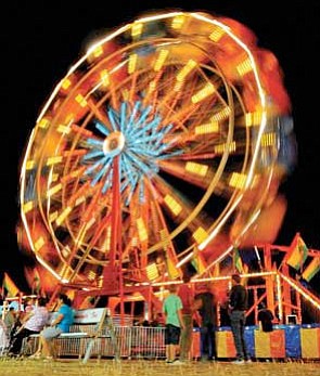 Matt Hinshaw/The Daily Courier<br>The ferris wheel spins during the opening night of the Yavapai County Fair in September of 2010 in Prescott Valley.