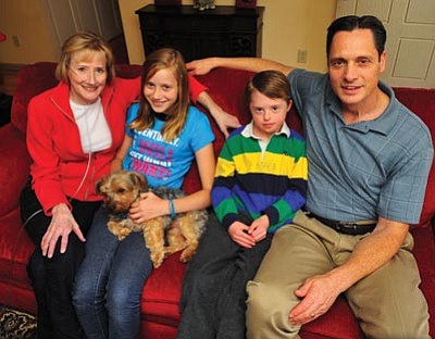 Les Stukenberg/The Daily Courier<br>Monica Kaplan – seen here with her daughter Rachel, son Trevor and husband Brad at their Prescott home – is on a waiting list for lung transplant.