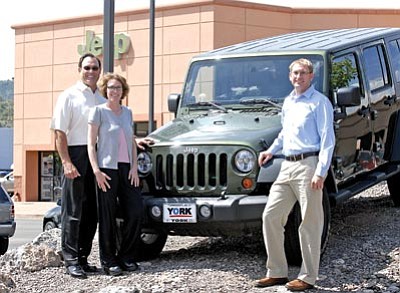 The Daily Courier/file photo<br>
Fred York, left, daughter Raigan Fundalewicz and son Toby York pose alongside a Jeep at York Motors in 2008, when the dealership celebrated 50 years of service to the Prescott area.