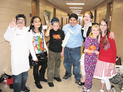 The Grand Canyon School Odyssey of the Mind team don their costumes before running through their competition problem at a rehearsal prior to last year’s World Finals. Pictured is Kyla Pearce, Jordan Long, Gunter Morris, Israel Herrera, Kylie Donehoo, Deya Ramos and an unidentified team member. Photo/WGCN
