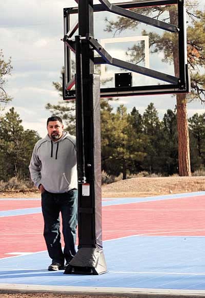 Grand Canyon School Project Manager Andrew Aldaz stands on the new sport court area. The court is the first phase of a three phase project that will bring greater recreation opportunities to Tusayan. Clara Beard/WGCN