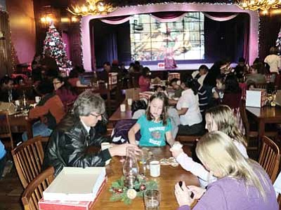 Tusayan councilmember Craig Sanderson and his family take part in last year’s holiday party at Big E Steakhouse.  Submitted photo