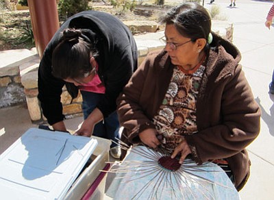 Jessica Lomatewama (right) and her daughter Janel weave baskets on the South Rim of the Grand Canyon during Archaeology Day festivities March 22. Photos by Katy Locke/WGCN and Dana Belcher/NPS