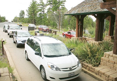 Wait time at entrance fee stations into Grand Canyon National Park can last 30 minutes or more. File photo