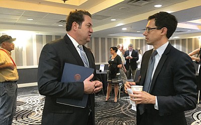 Arizona Attorney General Mark Brnovich (left) speaks to Glenn Hamer, president and CEO of the Arizona Chamber of Commerce and Industry, at a Arizona Manufacturers Council and chamber event. Photo/Curtis Spicer/Cronkite News