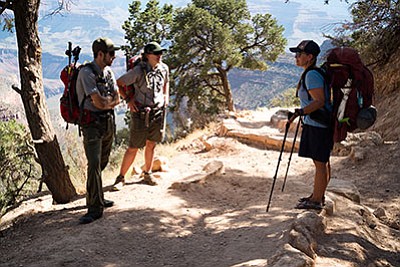 Grand Canyon Preventative Search and Rescue rangers Josh Weiner and AshleyButts stop on the Bright Angel Trail to ask hikers how far they are hiking. Loretta Yerian/WGCN