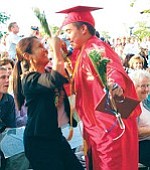 Lita Ebersole congratulates her nephew, Cody Bettencourt, after he received his diploma.
