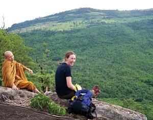 Middle school science teacher Jesse Smith enjoys the view with a Buddhist monk. In Thailand, monks take on much of the responsibility for conservation and sustainability, seeing it as consistent with their beliefs, Smith said.