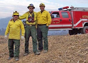 Local firefighters Jake Banks of Xanterra Fire & Security, Lawrence Barela of the Grand Canyon Airport Aeronautics Division, and Bob Blasi of the Kaibab National Forest, Tusayan Ranger District, assisted crews in California last month