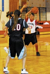 Middle school Lady Phantom Katreena Haswood looks to pass the ball at last month’s I-40 A-team tournament.