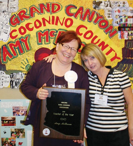 Amy McBroom and Grand Canyon School Superintendent Sheila Breen proudly display the award.