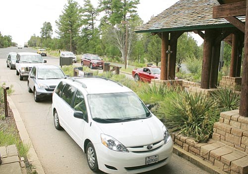 <br>Patrick Whitehurst/WGCN<br>
Cars line up at the South Rim entrance to Grand Canyon National Park.