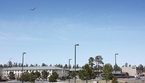 <br>Patrick Whitehurst/WGCN<br>
A plane flies over the town of Tusayan as it makes a descent toward the Grand Canyon Airport.