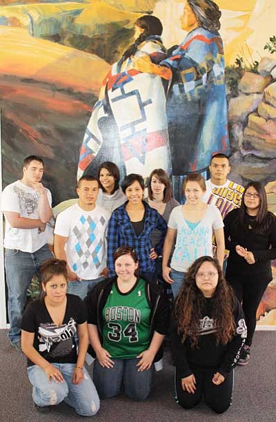 Patrick Whitehurst/WGCN<br>
Pictured are students in Grand Canyon School’s graduating senior class as they pose at the Shrine of Ages near the edge of the South Rim. Pictured is Miriam Bankston, Stephanie Begay, Daniel Celis, Keslee Foster, Veronica Garcia, Cuco Jaime, Tiffany Kerr, Tasha Ray, Monique Streit, Marissa Timeche and Erik Vessey.