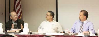 Clara Beard/WGCN<br>
Tusayan Town Manager Enrique Ochoa (right) and Tusayan Councilmen Al Montoya and Bob Blasi (right) discuss the Community Oriented Policing Services grant at the May 19 regular meeting of the Tusayan Town Council.