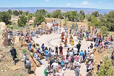Photo/NPS<br>
The Pollen Trail Dancers perform a traditional dance at the Landmark and Tribal Medallion near Mather Point during a celebration held June 15 to commemorate improvements at Mather Point and the Grand Canyon Visitor Center area.