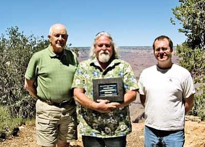 Submitted photo<br>
Hall of Fame Chair Al Richmond (left) and Grand Canyon Historical Society President Erik Berg stand with Bill Brookins after inducting Brookins into the Grand Canyon Hall of Fame.
(president GCHS)