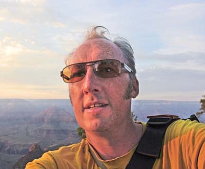 Submitted photo<br>
Sculpter and installation artist Antony Lyons walks along the South Rim of the Grand Canyon.
