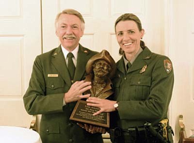 NPS Photo<br>
NPS Director Jon Jarvis presents Grand Canyon National Park Supervisory Ranger Lisa Hendy with the 2011 Harry Yount National Park Ranger Award.