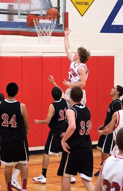 Ethan Berry drives to the hoop for two points.