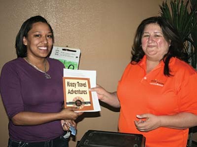 Photo/Bill Fitzgerald<br>
Grand Canyon Chamber General Manager Josie Bustillos presents one of many prizes to a lucky winner.