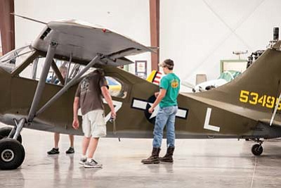 Visitors to the Planes of Fame Museum in Valle get an up close look at a vintage aircraft. The museum’s collection will be on display along with flown in P-51 Mustangs Saturday. Ryan Williams/WGCN