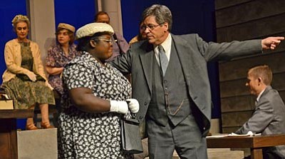 Karen Despain/The Daily Courier<br>
Atticus Finch (Kevin Nissen), right, the lead character in a Precott Center for the Arts stage production of Harper Lee’s classic novel, “To Kill a Mockingbird,” asks the Finch family’s cook and housekeeper Calpurnia (Nicosia Garrison) to get his children out of the courtroom and take them home.
