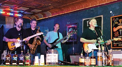 (Photo by Matt Hinshaw)<br>
The CheekTones perform Friday night at Hooligan’s Pub on Whiskey Row in downtown Prescott.