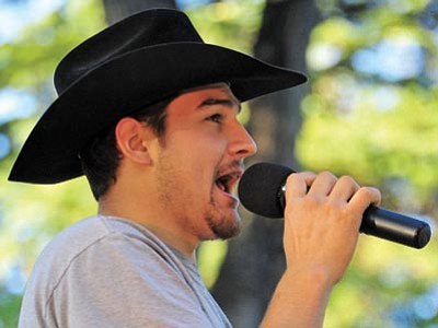 Logan Islas, left, of Cornville – a finalist this year – sings during the first performance of the fifth annual Prescott Idol. (Matt Hinshaw/The Daily Courier)