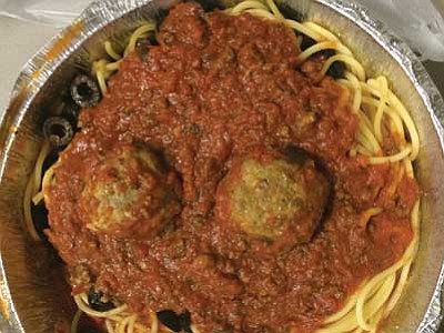 Spaghetti with meat sauce, meatballs and black olives from Genovese’s Italian Restaurant.
