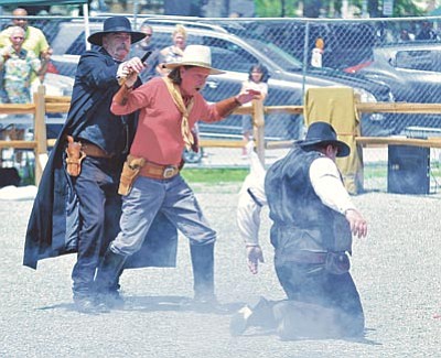 Members of the Arizona Gunfighters from Mesa re-enact the gunfight at the O.K. Corral during the ninth annual Whiskey Row Shootout, hosted by the Prescott Regulators and their Shady Ladies. This year’s event is July 25-26 downtown. (Matt Hinshaw/The Daily Courier, file)