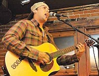 Matt Hinshaw/The Daily Courier<br>Ikaika Beamer performs some original reggae tunes Oct. 19  at Annie's Attic in Prescott.
