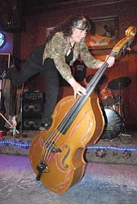 Courtesy photo<br>Micky Rae answered an ad to be in the Cadillac Angels in 1986, learned to play bass – and became the bass player.