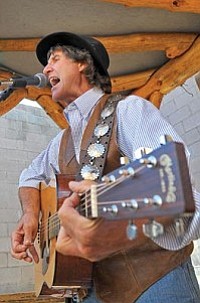 Matt Hinshaw/The Daily Courier<br>
Brad Newman performs Tuesday evening at Coyote Joe's in Prescott. Newman is the Director of Yavapai Exceptional Industries and has been a Grand Canyon river guide for the past 26 years.
