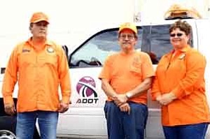 <i>Photo by Jeff Pope</i>
<b>Gary Warren (left), Marcelo Vargas and Frances McCauley have donned the orange for ADOT for a combined 90 years.</b>