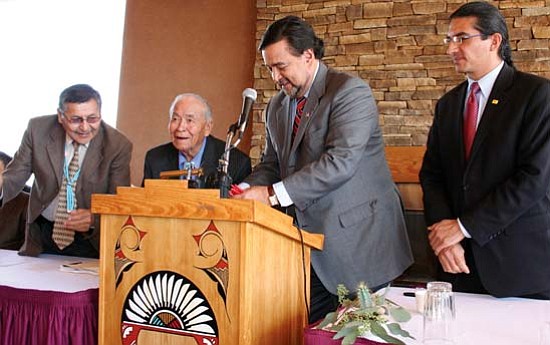 <i>Photo by Rima Krisst</i><br>
Navajo Nation Vice President Ben Shelly, Sen. John Pinto and Secretary for Indian Affairs Alvin Warren watch as New Mexico Governor Bill Richardson signs the historic State Tribal Collaboration Act (Senate Bill 196) at the Indian Pueblo Cultural Center in Albuquerque. The Act will enhance government-to-government communication and collaboration between the state and tribal governments.