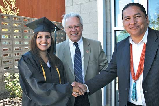 New CCC graduate Cristina Linn (left), her uncle District 2 Rep. Tom Chabin (center)  and Diné College President Ferlin Clark celebrated CCC’s commencement on Friday. Clark’s nephew was a CCC graduate as well.